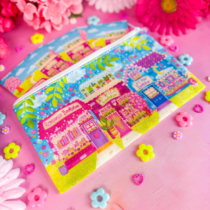 Bookshop Avenue bookmark pouch on a pink backdrop