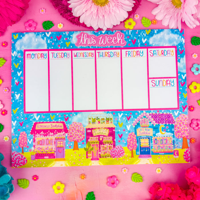 A weekly planner notepad with "this week" at the top and 3 spring themed bookshops along the bottom.